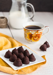 truffle chocolates with a cup of coffee and cream