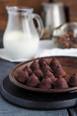truffle chocolates with a cup of coffee and cream