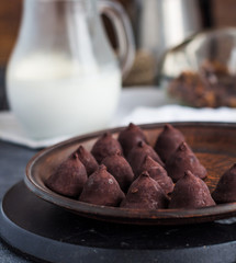 truffle chocolates with a cup of coffee and cream