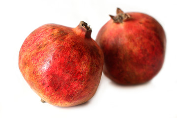 Ripe pomegranates on white background