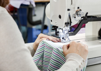 Industrial sewing machines with sewing machine operator