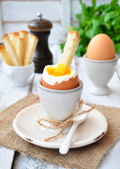 boiled egg for breakfast on a wooden table