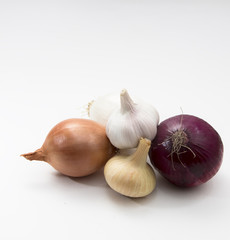 fresh vegetables garlic and onions on the white background