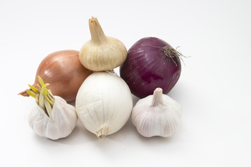 fresh vegetables garlic and onions isolated on the white