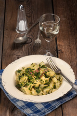 Spaghetti with spinach and bacon.