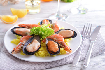 Seafood Paella on plate on table close-up