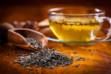 Dry tea on wooden table
