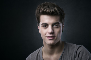 Fototapeta premium Smiling handsome young man posing