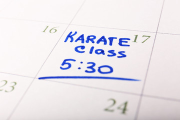 Obraz premium Written plan Karate Class on calendar page background