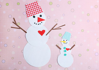 Handmade snowmen on bright background