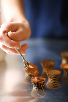 Preparation handmade chocolate candies, close up