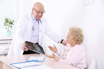 Fototapeta premium Doctor and patient in hospital clinic