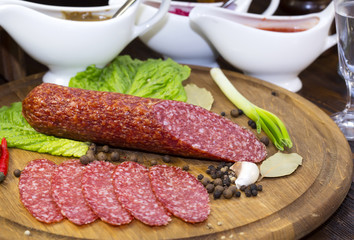sausage on a wooden plate in a restaurant