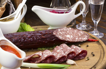 sausage on a wooden plate in a restaurant