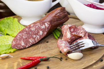 sausage on a wooden plate in a restaurant