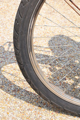 part of the wheel from the bicycle.