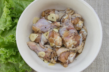 Raw ingredient,Chicken Drumstick, garlic, black pepper and salt