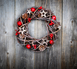 Christmas wreath on wooden background © irishmaster