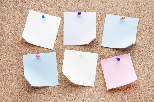blank notes and multicolored thumbtacks