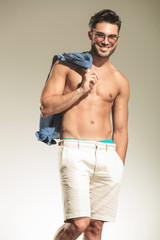 Happy young fashion man smiling to the camera