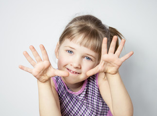 Pretty little girl showing her palms