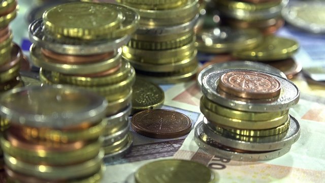 Euro Banknotes and Coins (dolly shot)