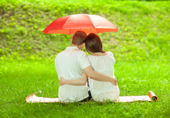 Couple in love under umbrella