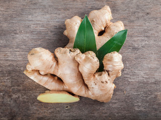 Ginger root sliced on wooden table