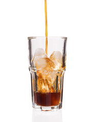 Cola glass with falling ice cubes