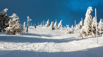 Fototapeta na wymiar view of crosscountry skiing way and mount Serak