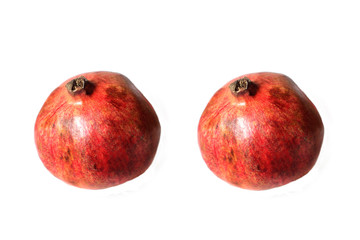 Two pomegranates on white background