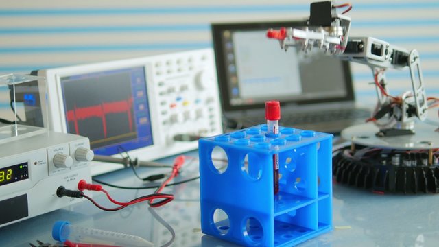 Experimental robot adds vials in a box