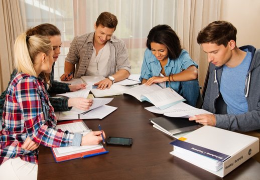 Students preparing for exams in home interior 