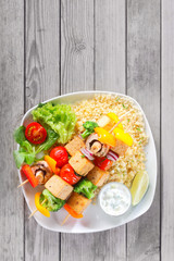 Aerial Shot of Kebabs on Rice with Veggies