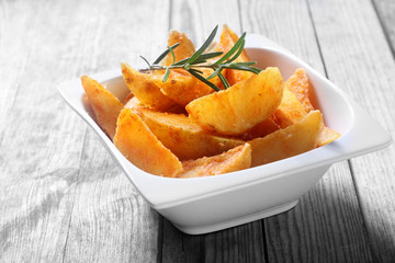 Fried Potato Snacks on Bowl on Wooden Table