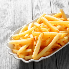 Cooked French Fries on White Plate on the Table
