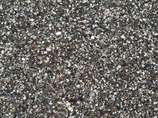Wet colored pebbles background texture