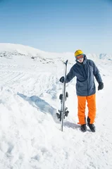 Fotobehang Skier sportsman at winter ski resort © disq