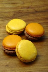 Colored macaroons on wooden table