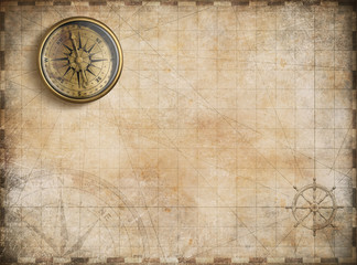 Fototapeta na wymiar vintage golden compass with nautical map background
