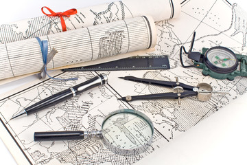 Old Maps with compass and magnifier