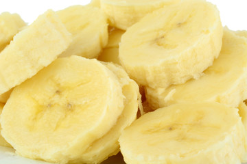 Macro shot of slices of banana on white background