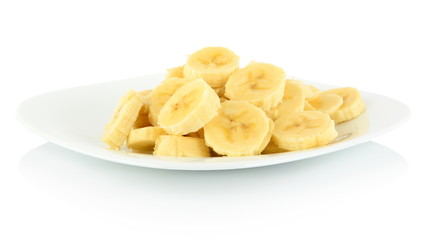 Macro shot of slices of banana on plate on white
