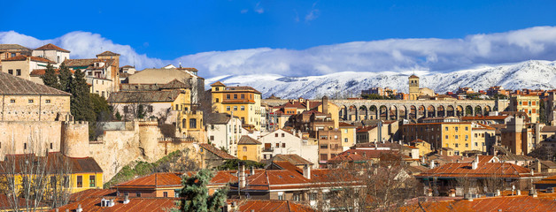 panoramic view of Segovia with aqueduct and mountains, Spain