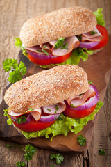 sandwich with ham tomato and lettuce
