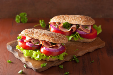 sandwich with ham tomato and lettuce