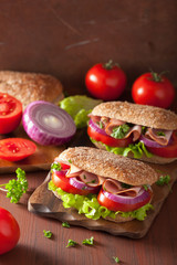 healthy sandwich with ham tomato and lettuce