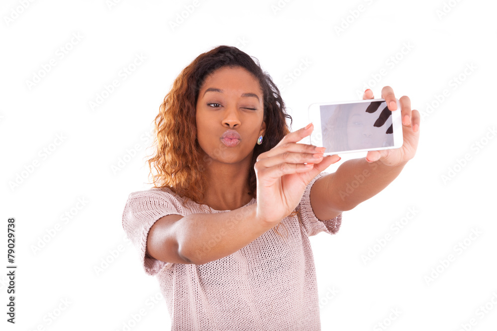 Wall mural Young African American woman taking a selfie - self portrait - B