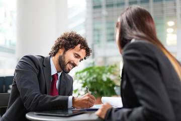 Couple of  working business people