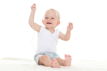 Small baby listening to music.